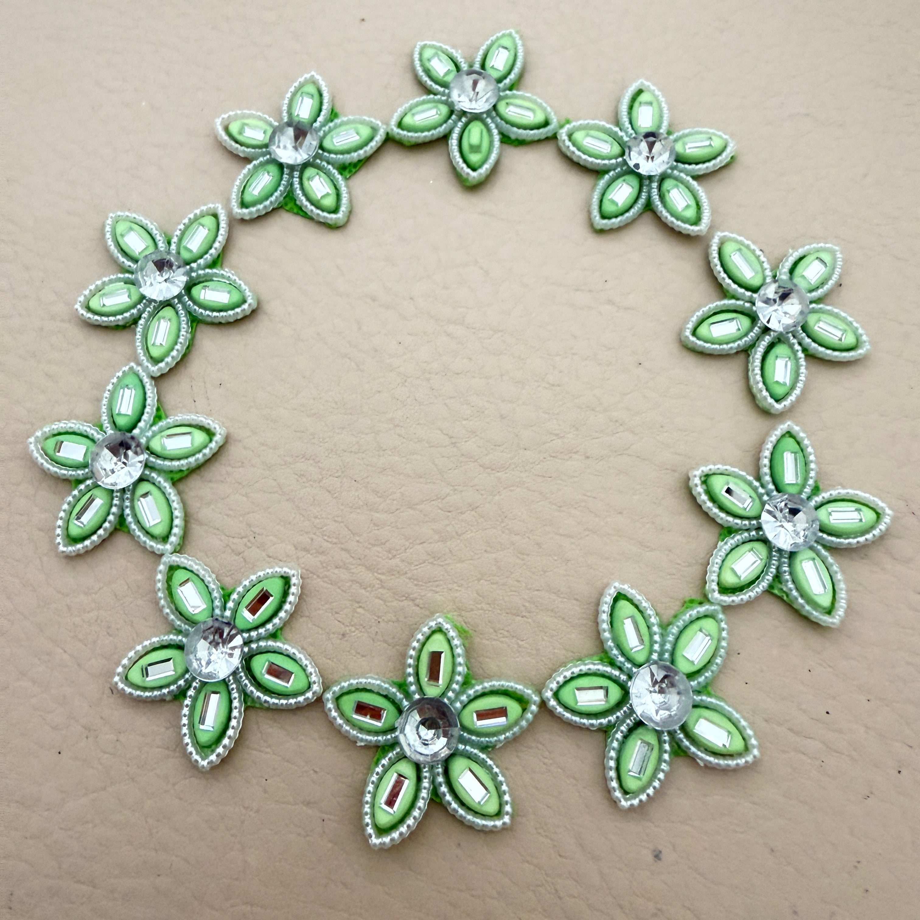 25 mint green rhinestone flower motif patches arranged in a circle