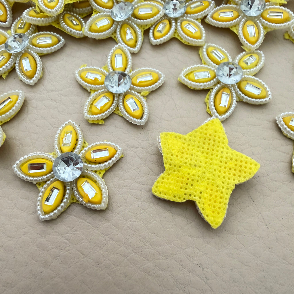 Front and back view of yellow rhinestone star flower motif patch showing foam base