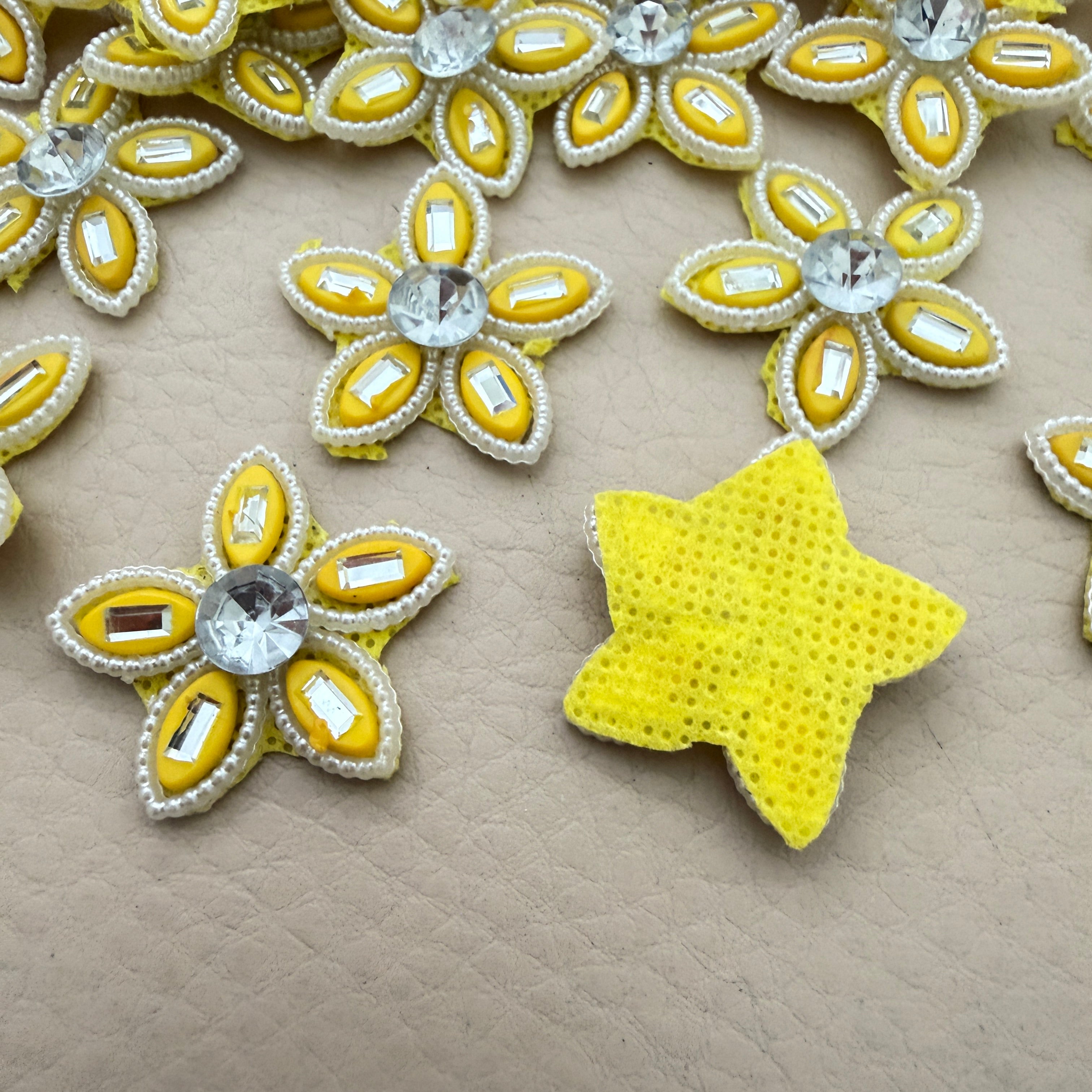 Front and back view of yellow rhinestone star flower motif patch showing foam base