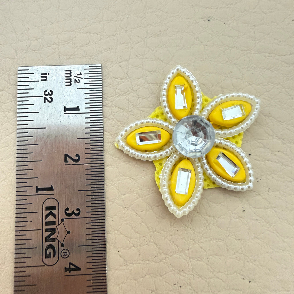 Yellow rhinestone star flower motif patch next to ruler showing approx 3.5cm size