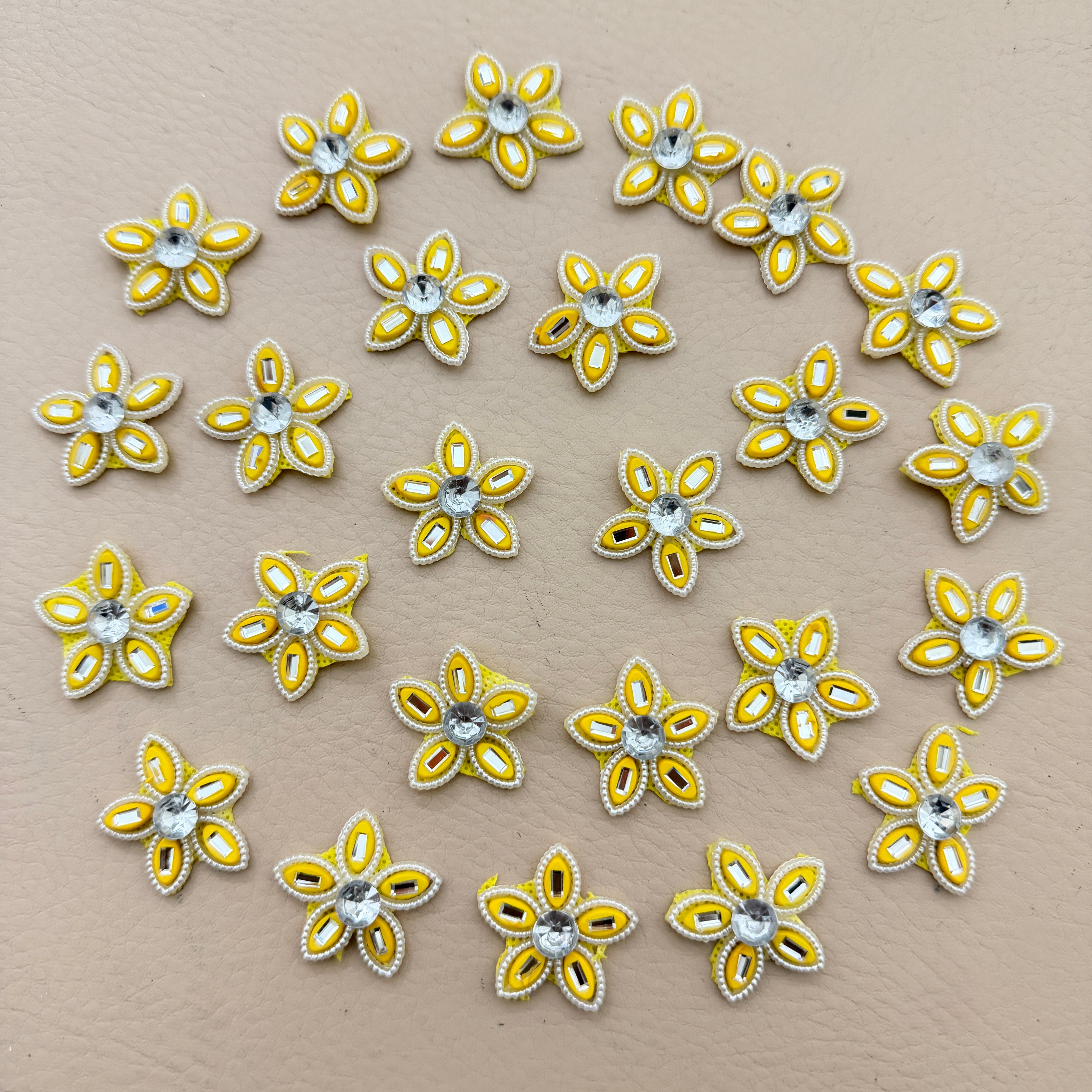 25 yellow rhinestone star flower motif patches arranged in a circle