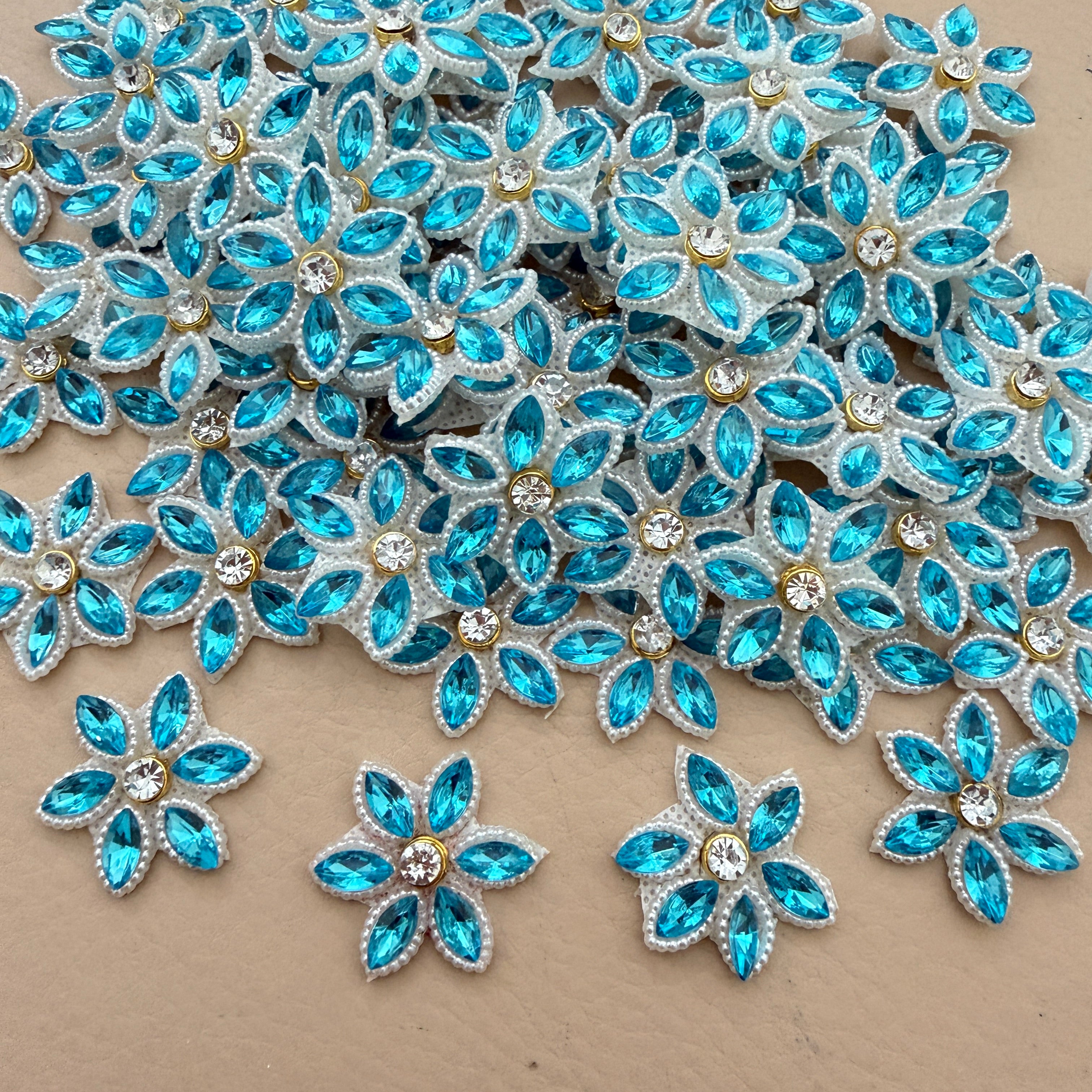 Bulk lot of aqua blue marquise rhinestone star flower motif patches spread out