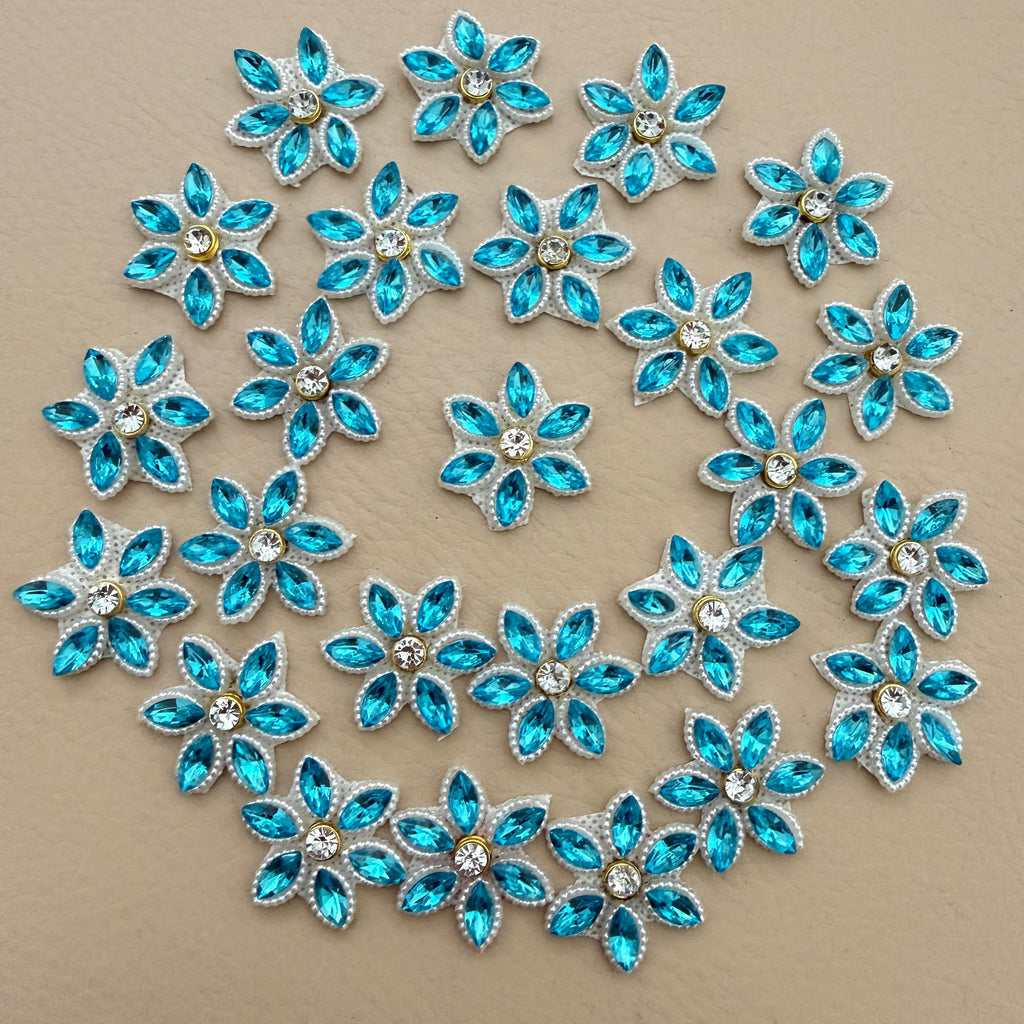 25 aqua blue rhinestone star flower motif patches arranged in a circle