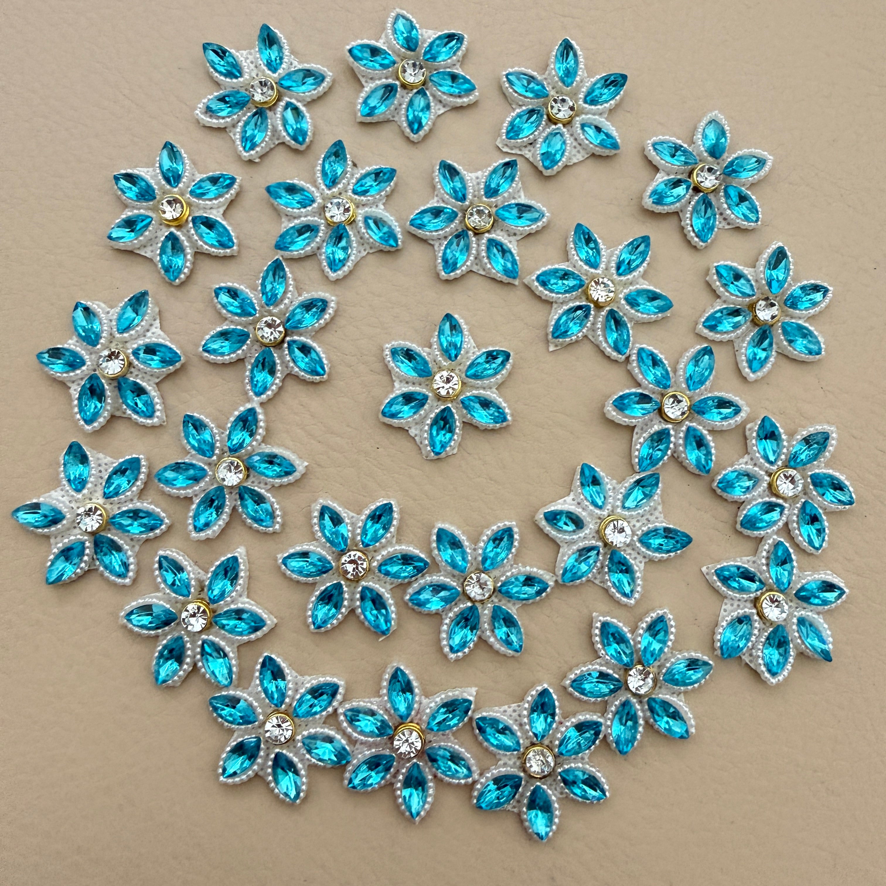 25 aqua blue rhinestone star flower motif patches arranged in a circle