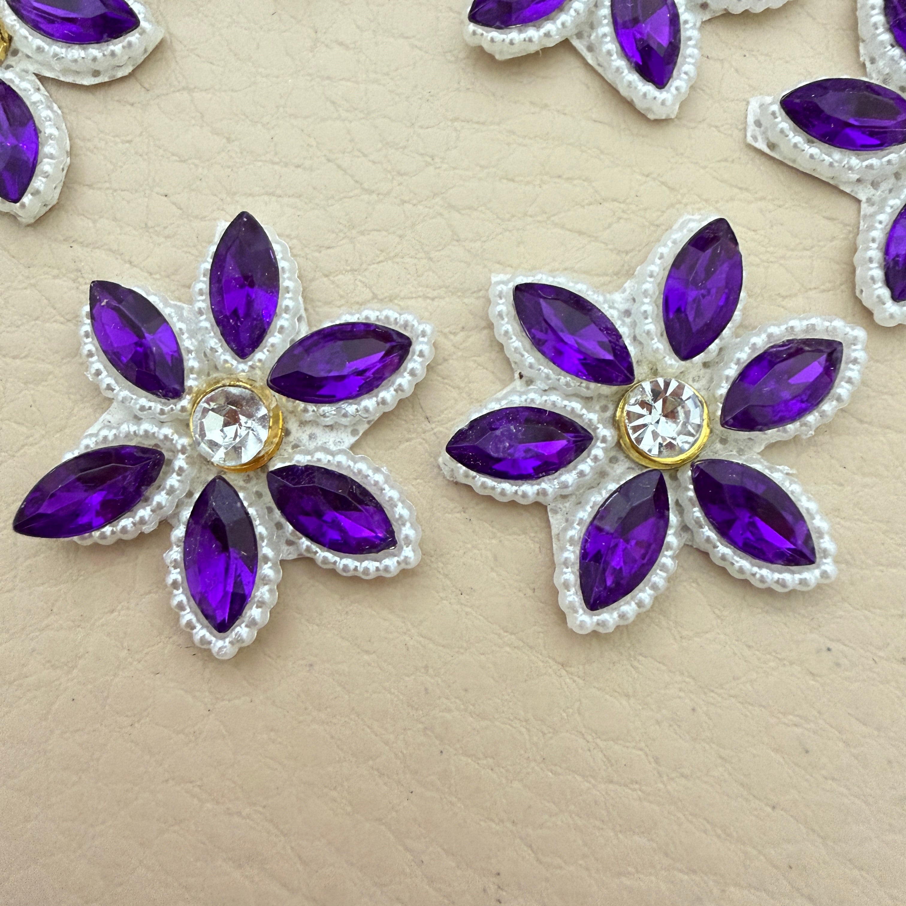 Two purple marquise rhinestone star flower motif patches showing front detail up close