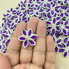 Purple marquise rhinestone star flower motif patch held in hand showing size