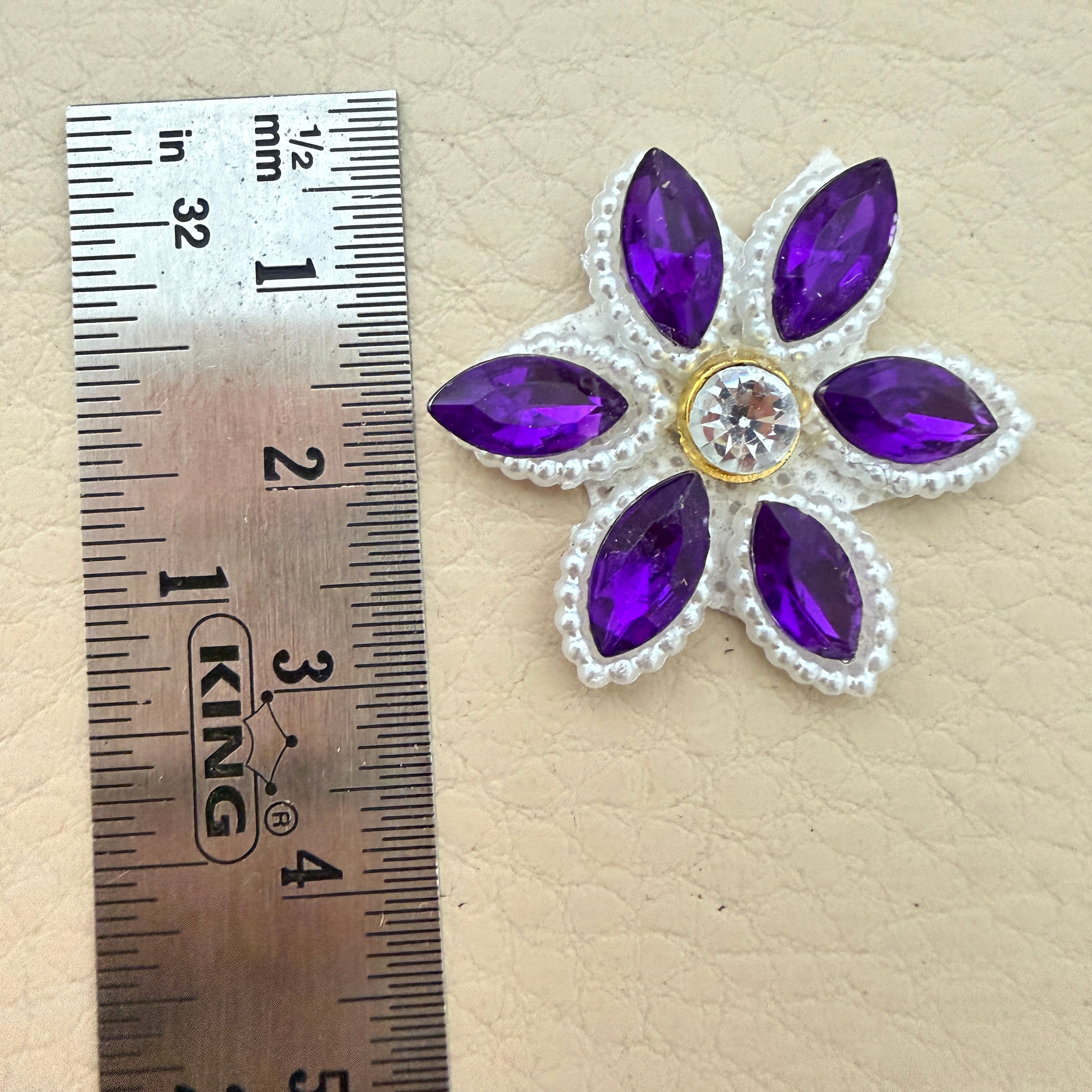 Purple marquise rhinestone star flower motif patch next to ruler showing approx 3.5cm size