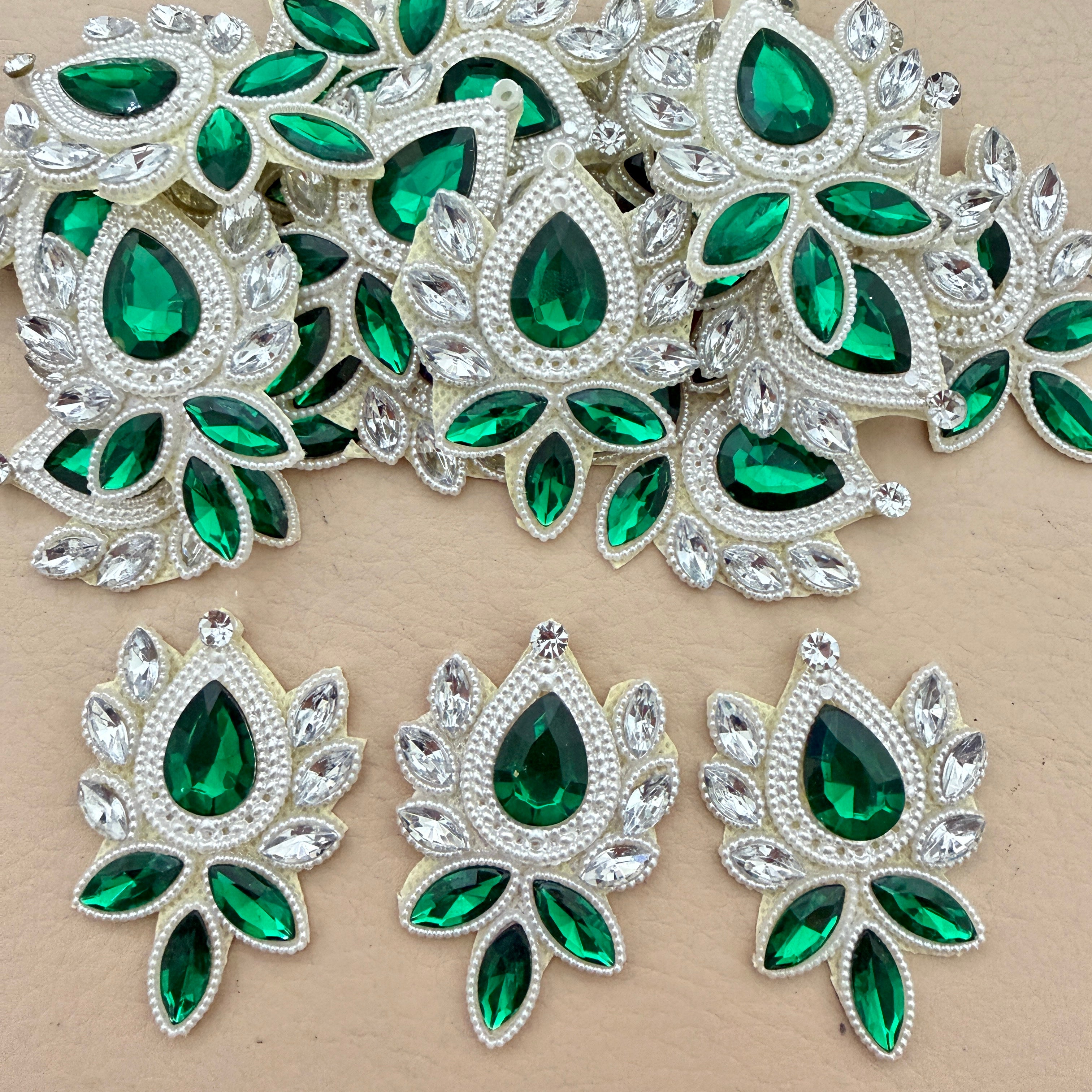 Emerald green crystal rhinestone patches bulk view
