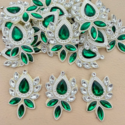 Emerald green crystal rhinestone patches bulk view