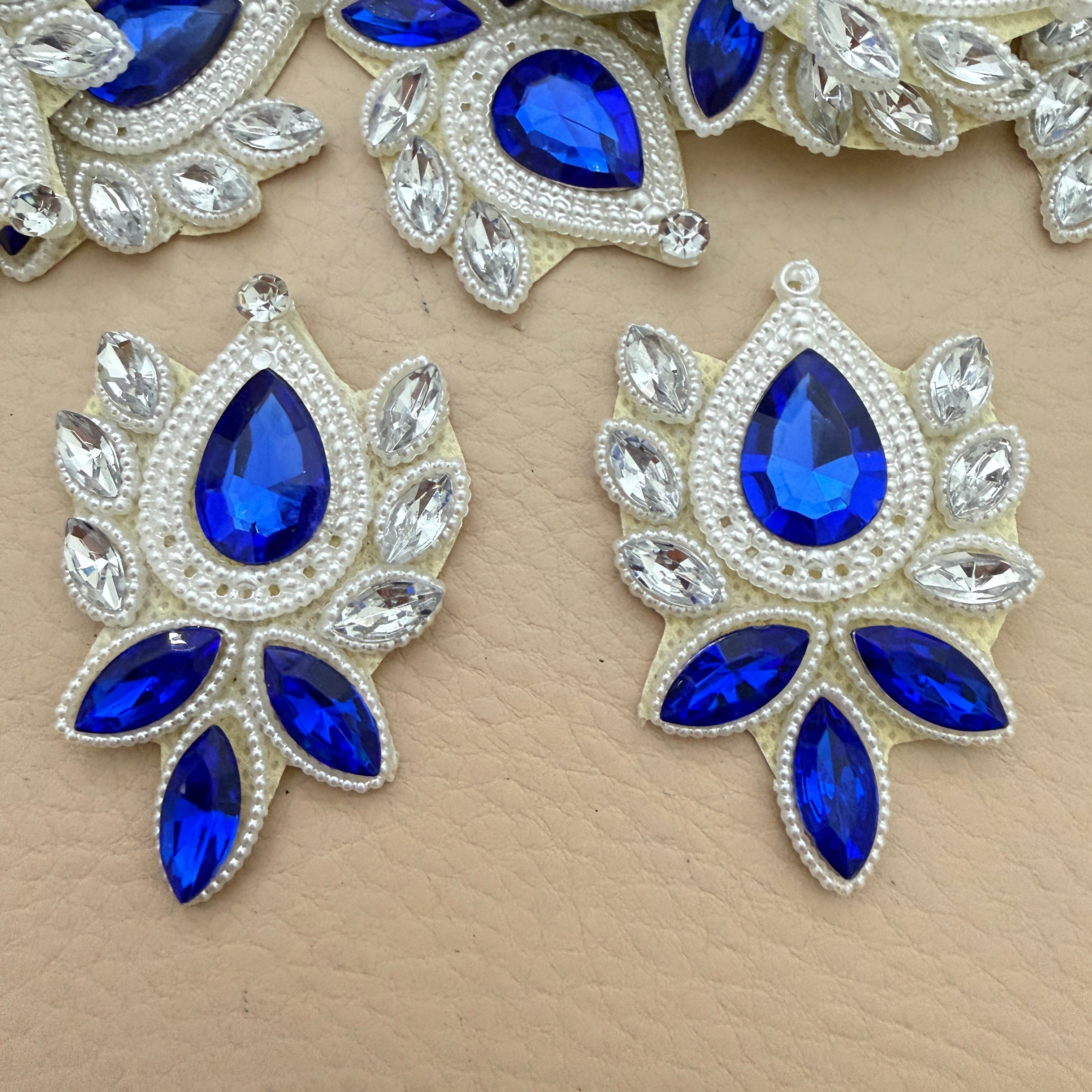 Two royal blue rhinestone patches front view