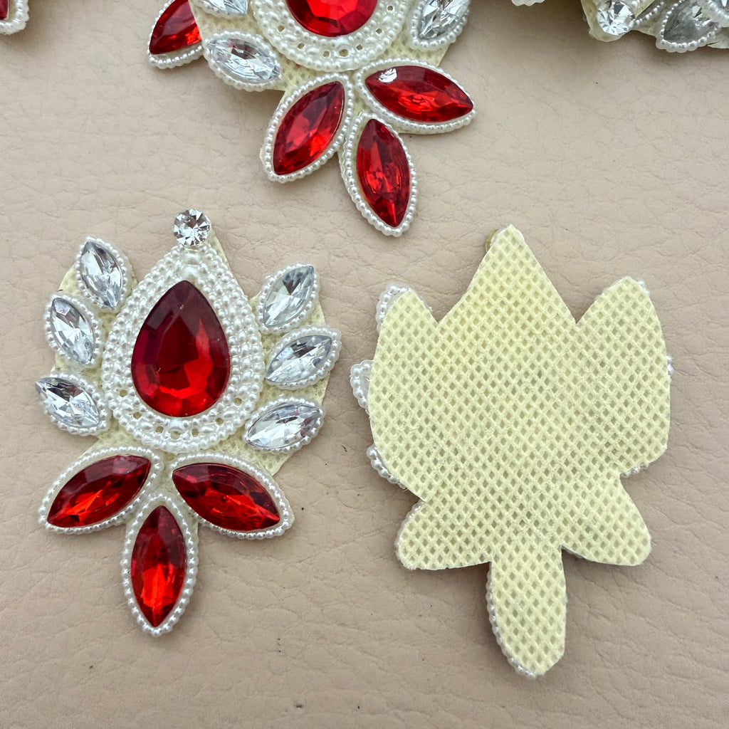 Front and back view of ruby red rhinestone patch showing ivory mesh base