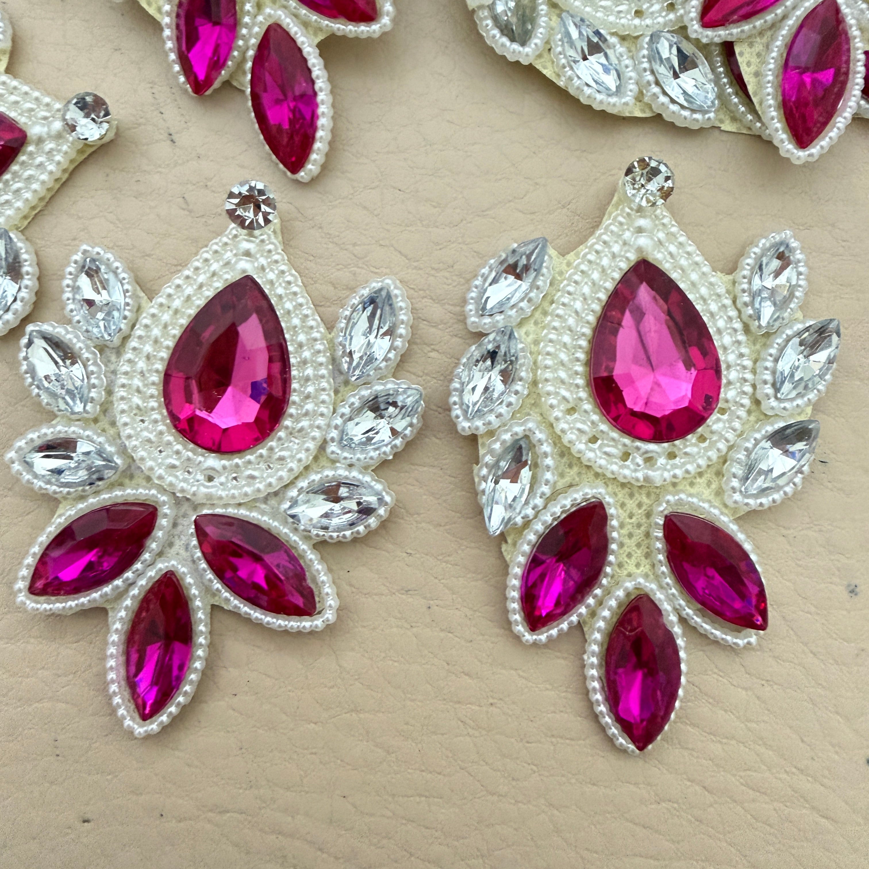 Close-up front view of two fuchsia rhinestone patches