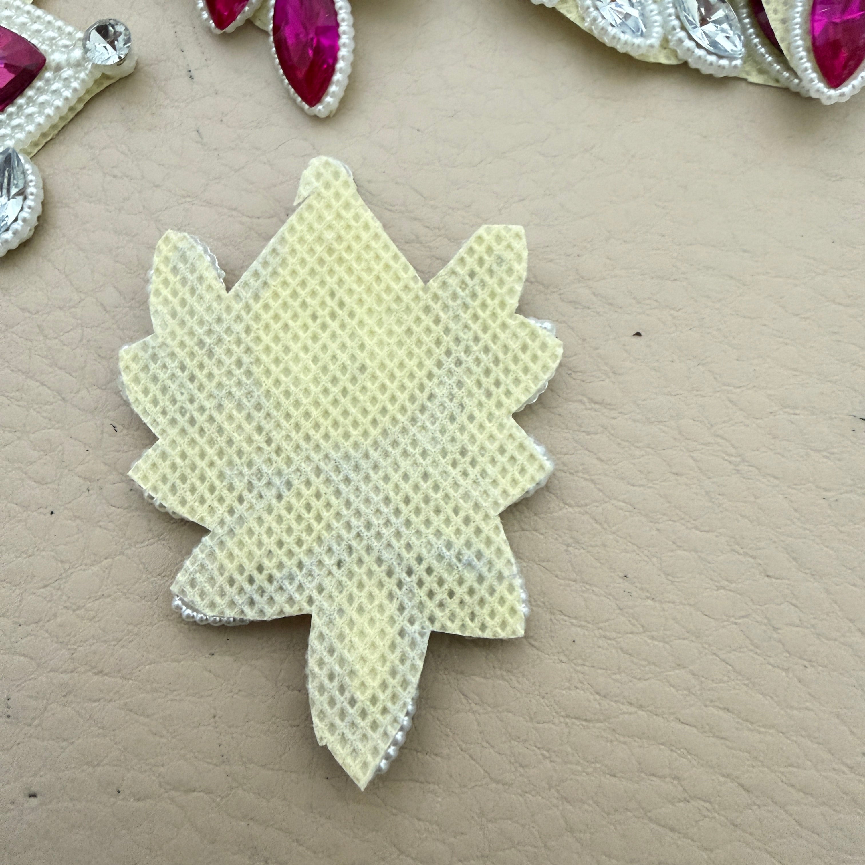 Back view of fuchsia rhinestone patch showing ivory mesh base
