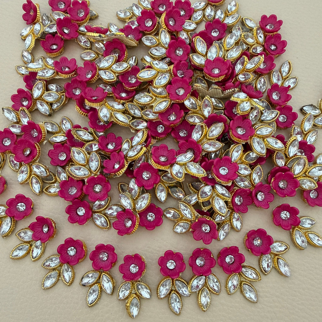 Pink flower and leaf applique patch with clear rhinestone-style stones and gold-tone edging