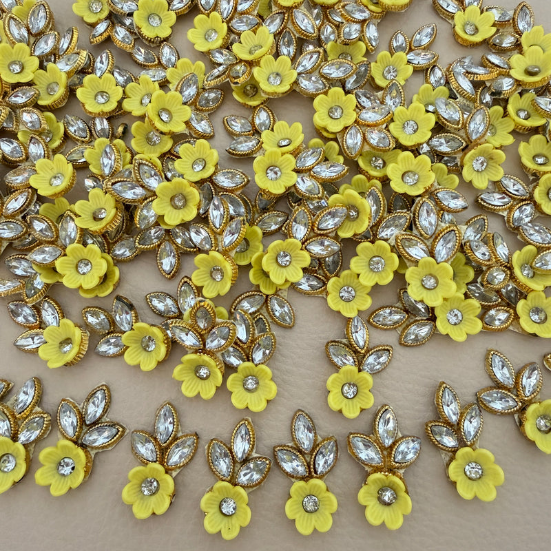Yellow flower and leaf applique patch with clear rhinestone-style stones and gold-tone edging
