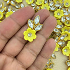 Back view of yellow flower and leaf applique patch showing the light fabric backing