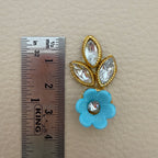 Back view of sky blue flower and leaf applique patch showing the light fabric backing