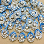 Sky blue teardrop rhinestone floral patch held in hand