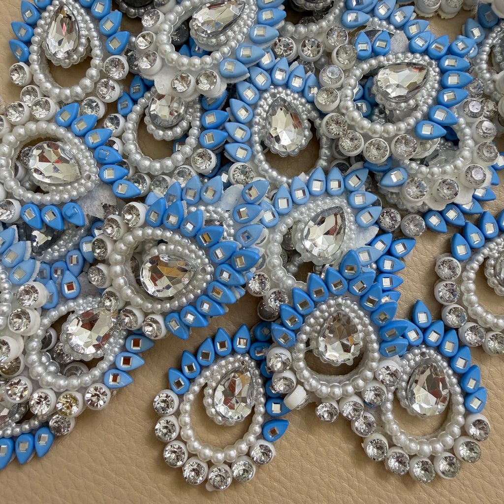 Sky blue rhinestone pearl patch next to ruler showing size