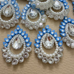 Close-up of sky blue floral patches with clear teardrop stones