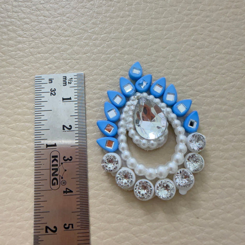 Front and white felt back of sky blue rhinestone patch
