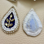 Front and white mesh back of navy blue kundan patch