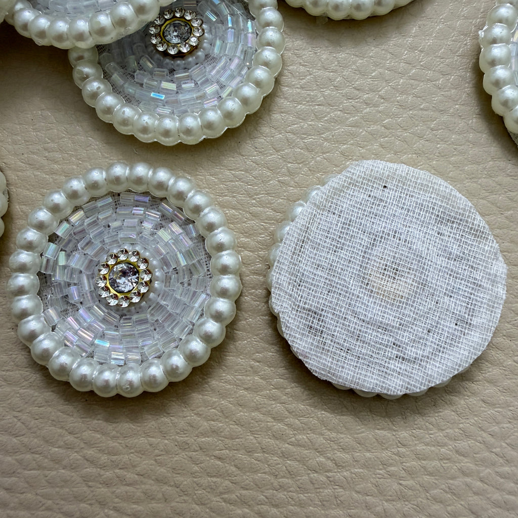 Front and white mesh back of pearl bead round patch