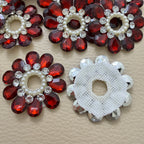 Front and white mesh back of maroon rhinestone flower patch