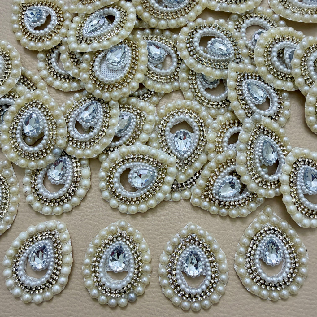 Pearl and rhinestone teardrop patch front beside white mesh backing