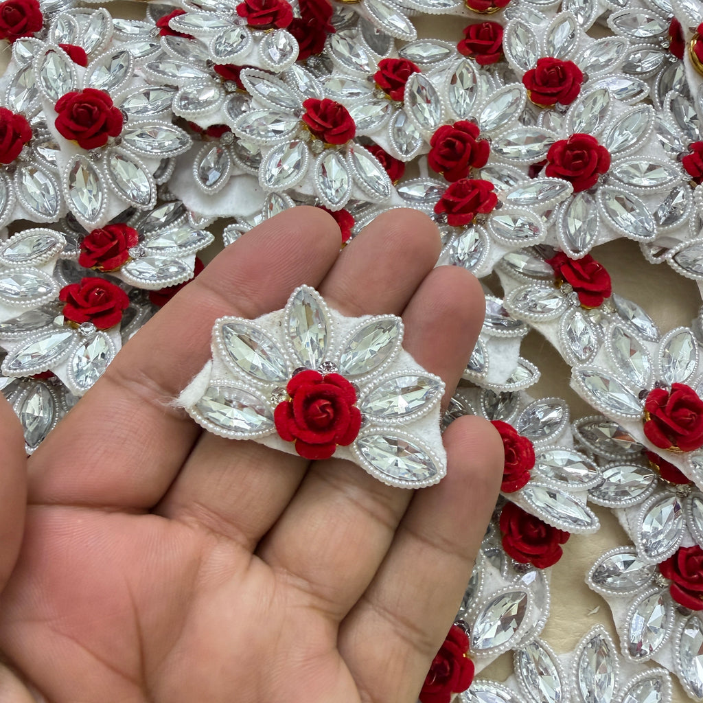 Back view of white felt backing on a maroon rose rhinestone flower motif patch
