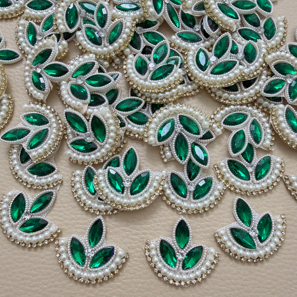 Green leaf motif patch beside a ruler for size reference