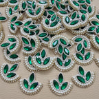 Green leaf motif patch beside a ruler for size reference
