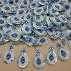 Front and white mesh backing of blue pearl and sequin teardrop patch