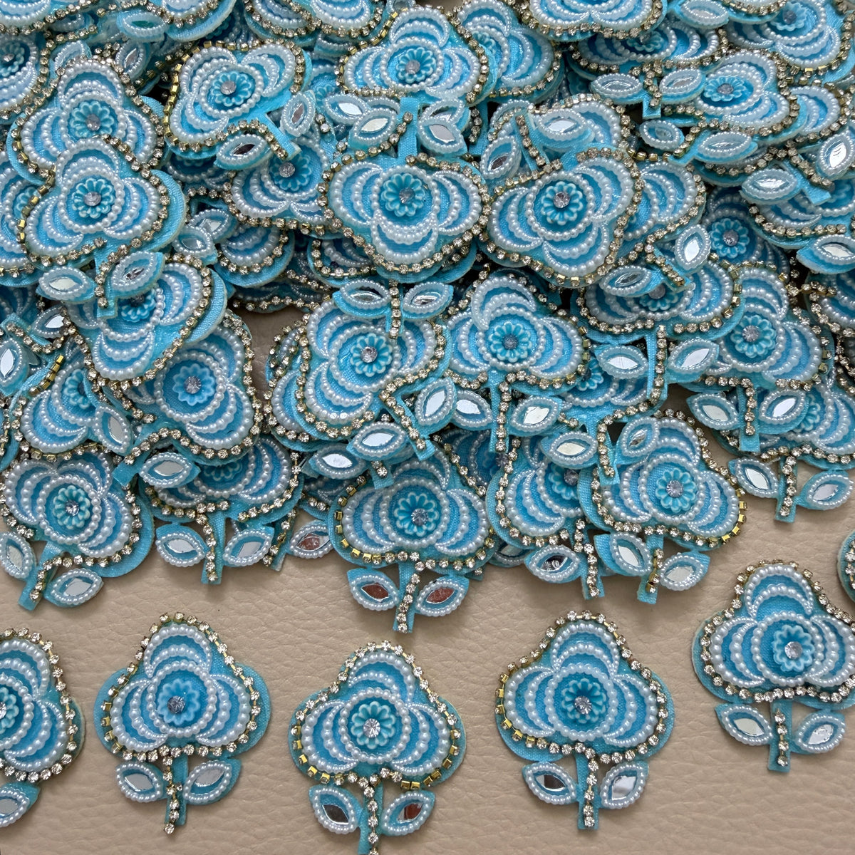 Group of sky blue pearl and mirror-look floral patches