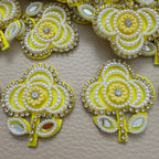 Group of yellow pearl and mirror-look floral motif patches