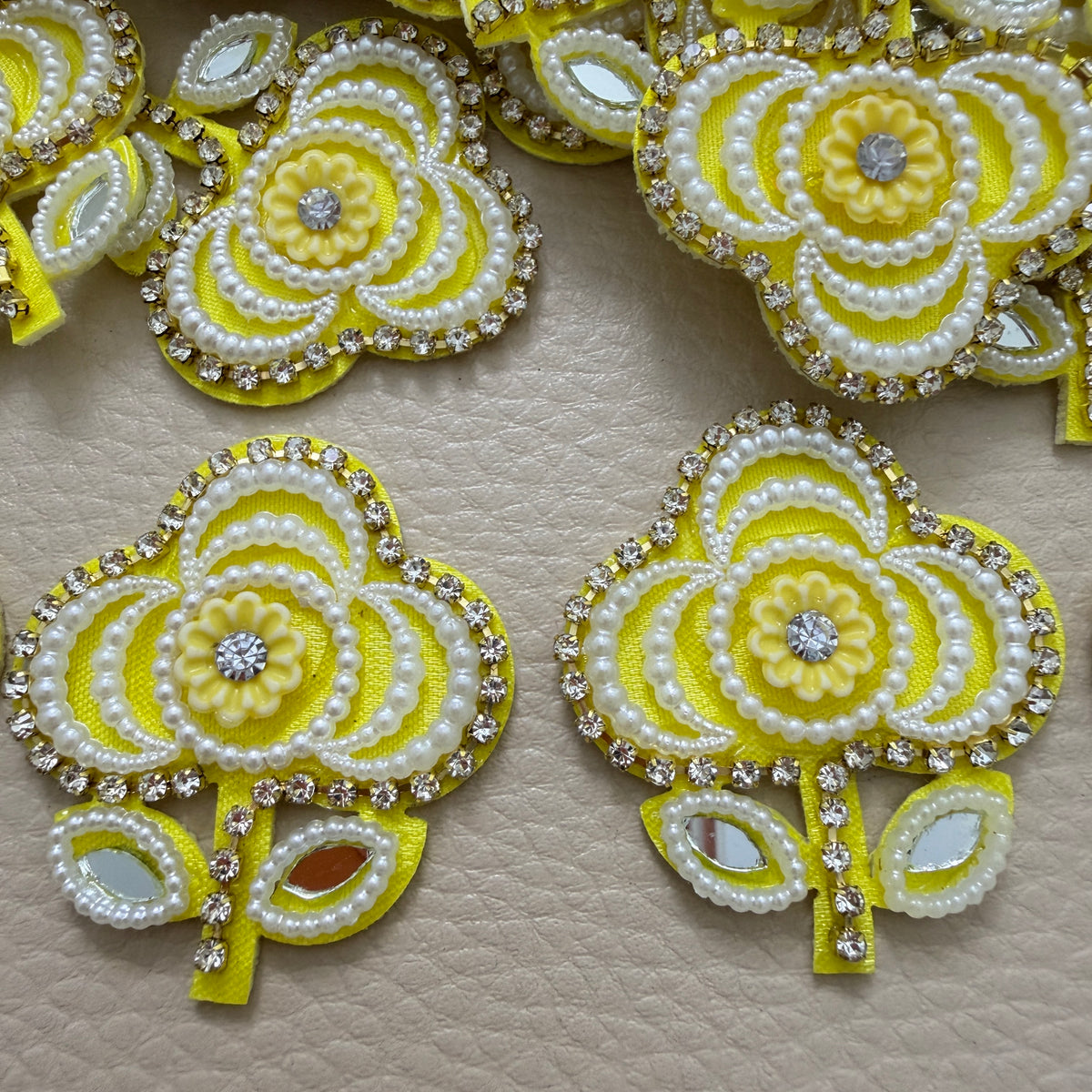Group of yellow pearl and mirror-look floral motif patches