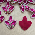 Group of pink embellished three-leaf applique patches