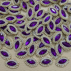 Purple marquise stone patches with white pearl-look beads and gold-tone rhinestone borders