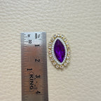 Purple marquise patch held in a hand for scale