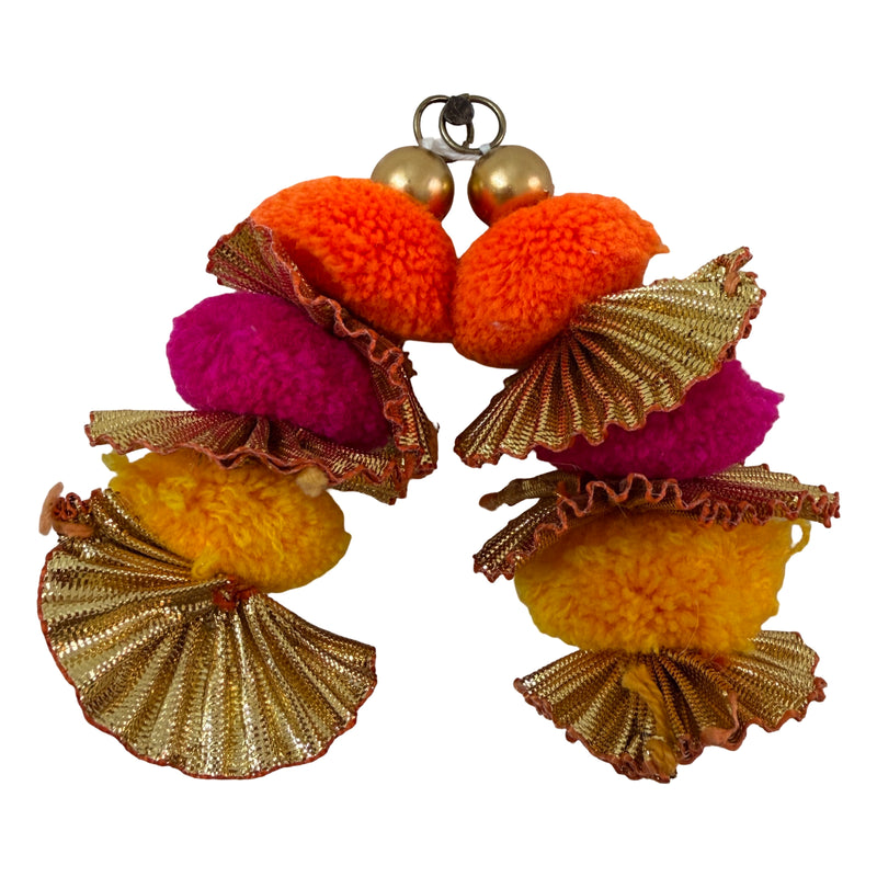 Pom pom latkan tassel with ruler for size reference