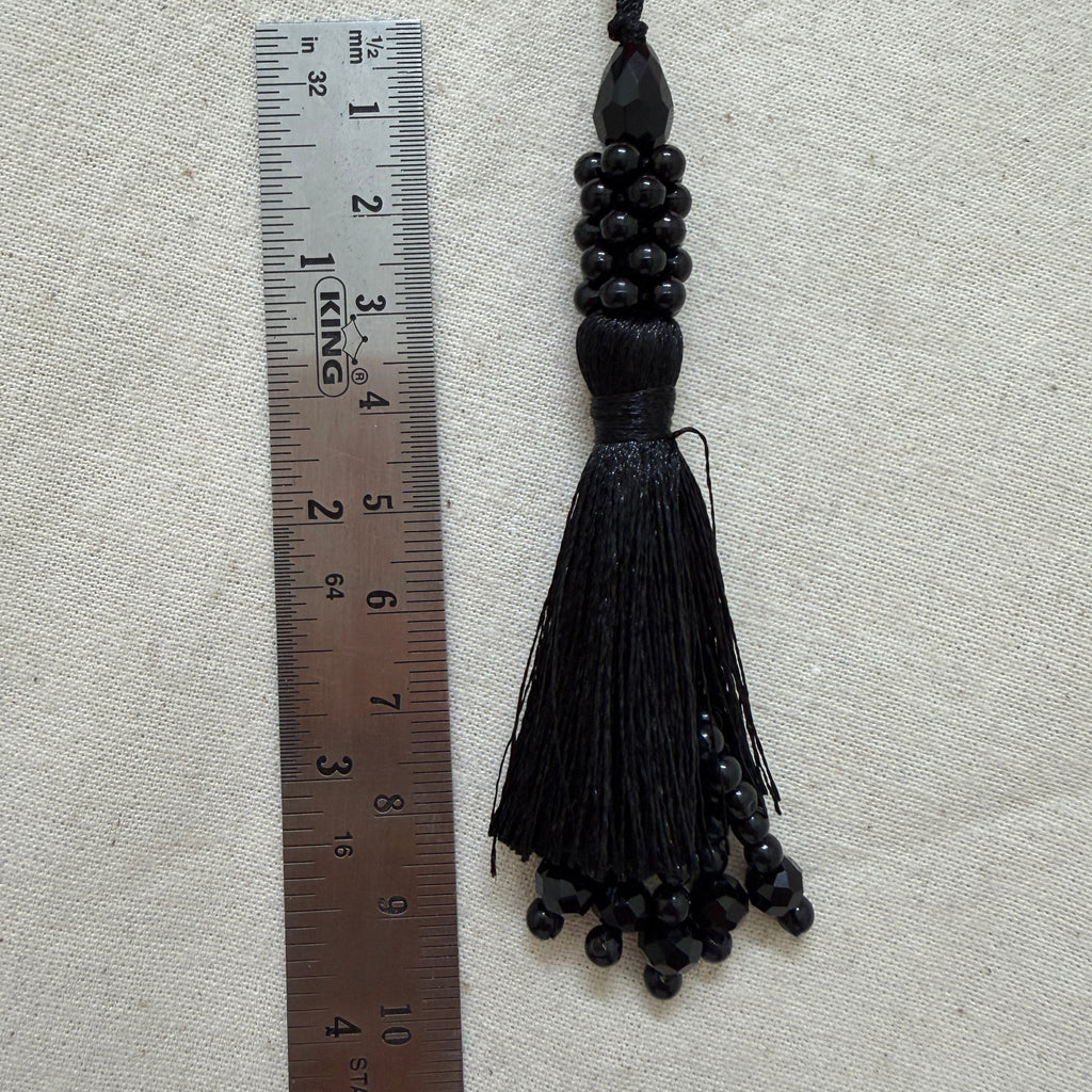Pack of black beaded tassel latkans laid flat
