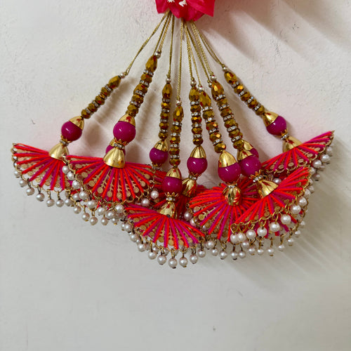 Multiple fan tassel latkans hanging together showing full collection