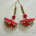 Pair of fan tassel latkans laid flat showing front detail