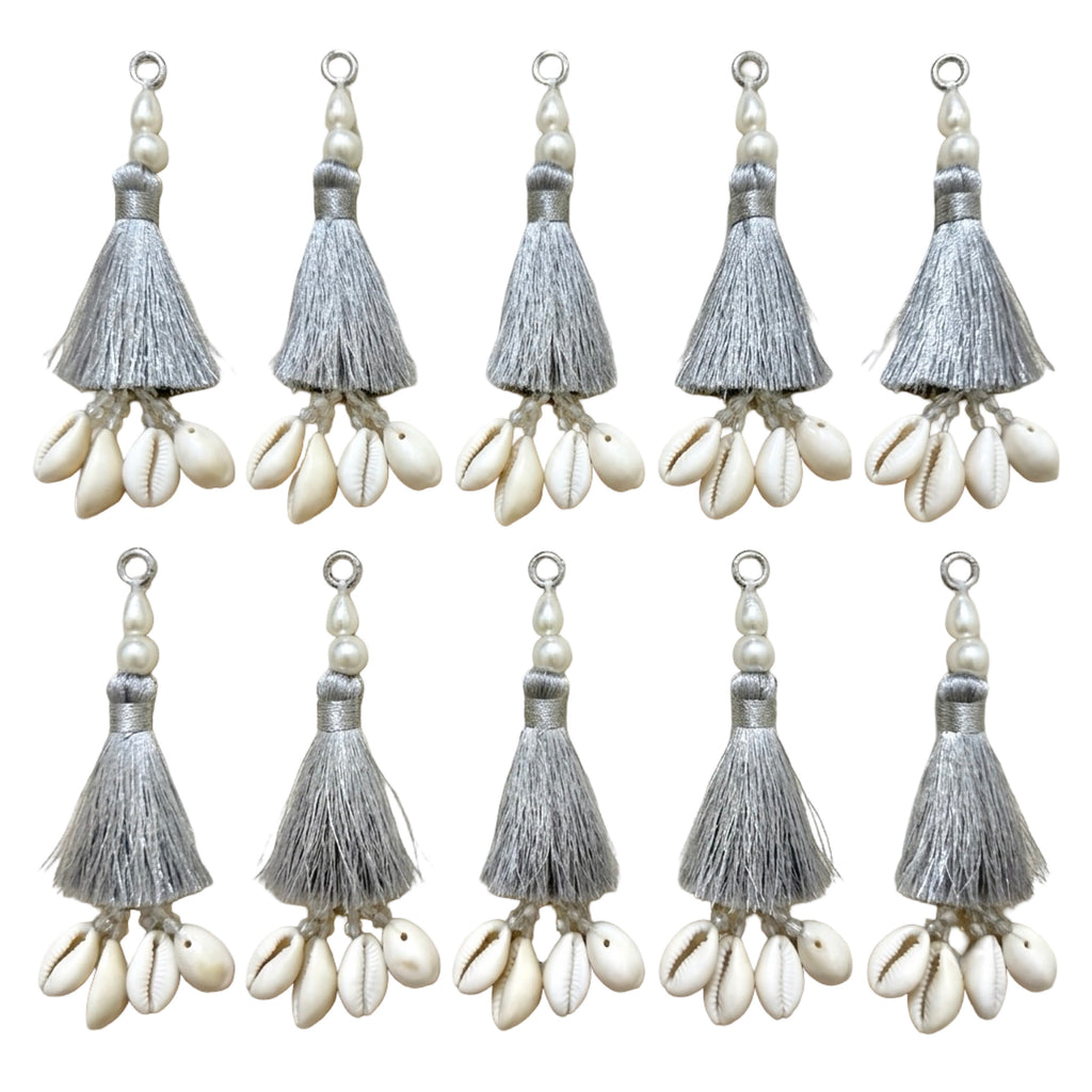 10 silver silk tassels with cowrie shells and pearl beads on white background