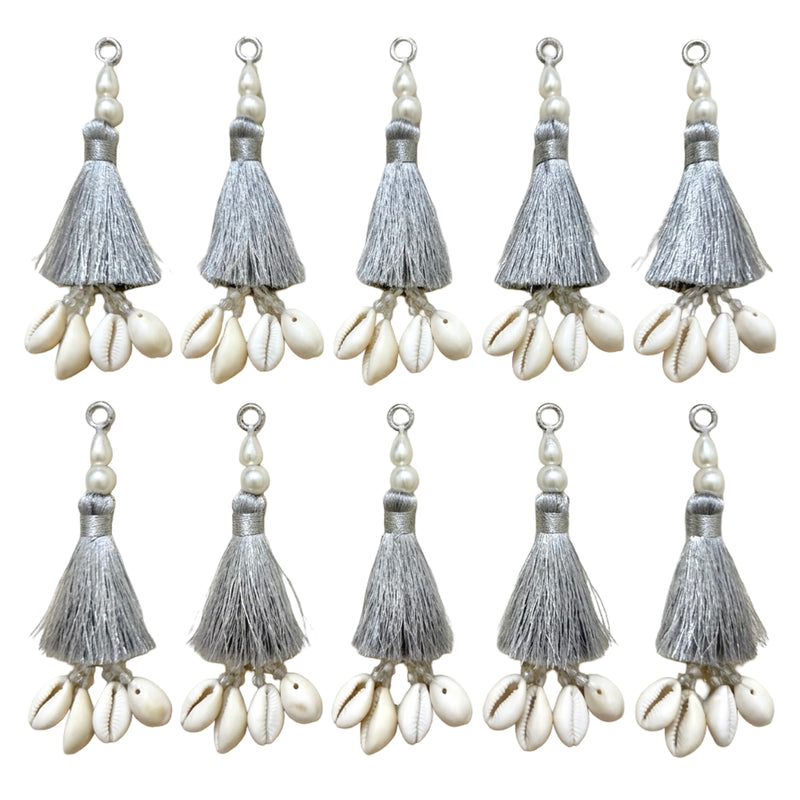 10 silver silk tassels with cowrie shells and pearl beads on white background