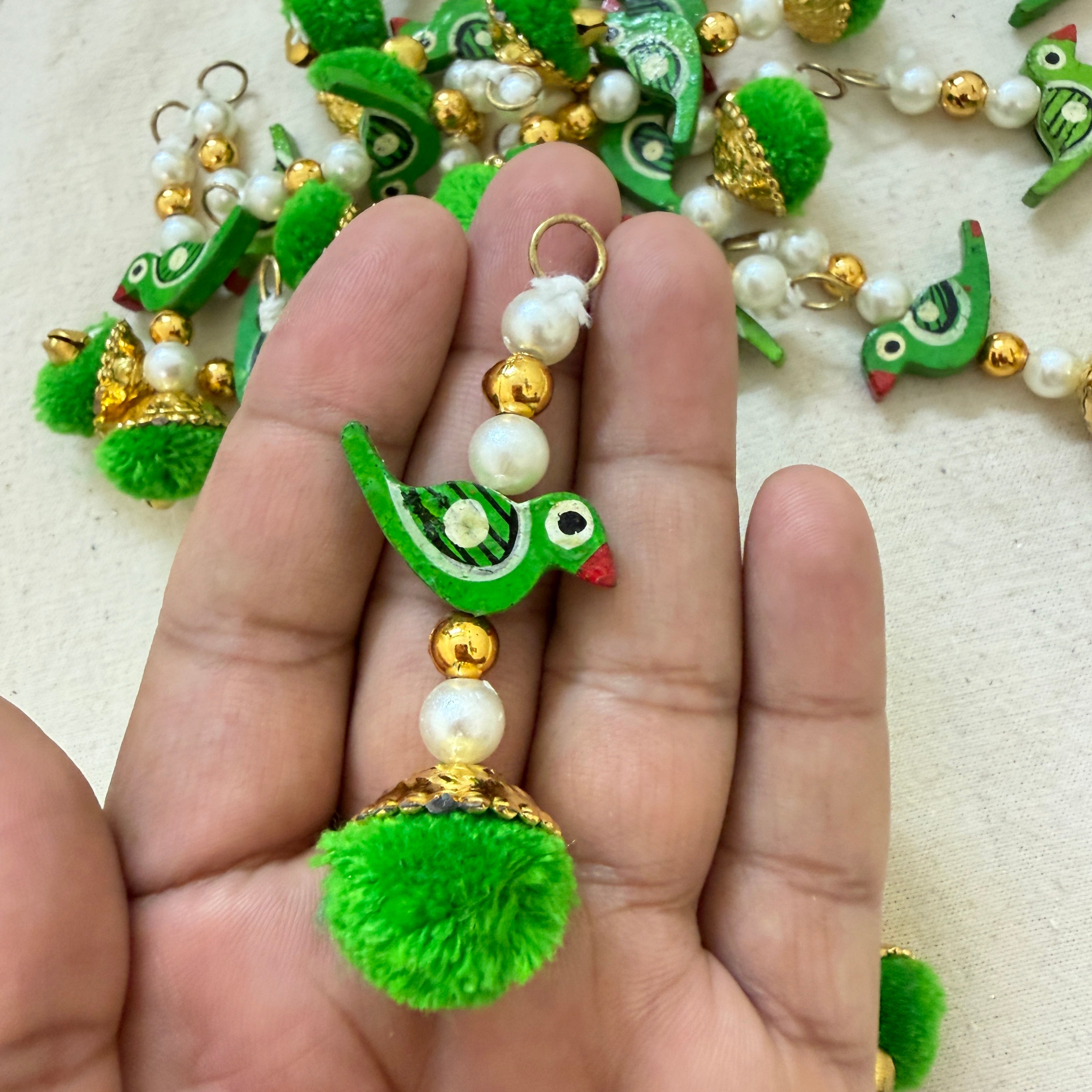 Bulk lot of Green Parrot Pom Pom Tassels spread out