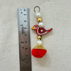Red Bird Pom Pom Tassel with ruler showing approx 8cm length