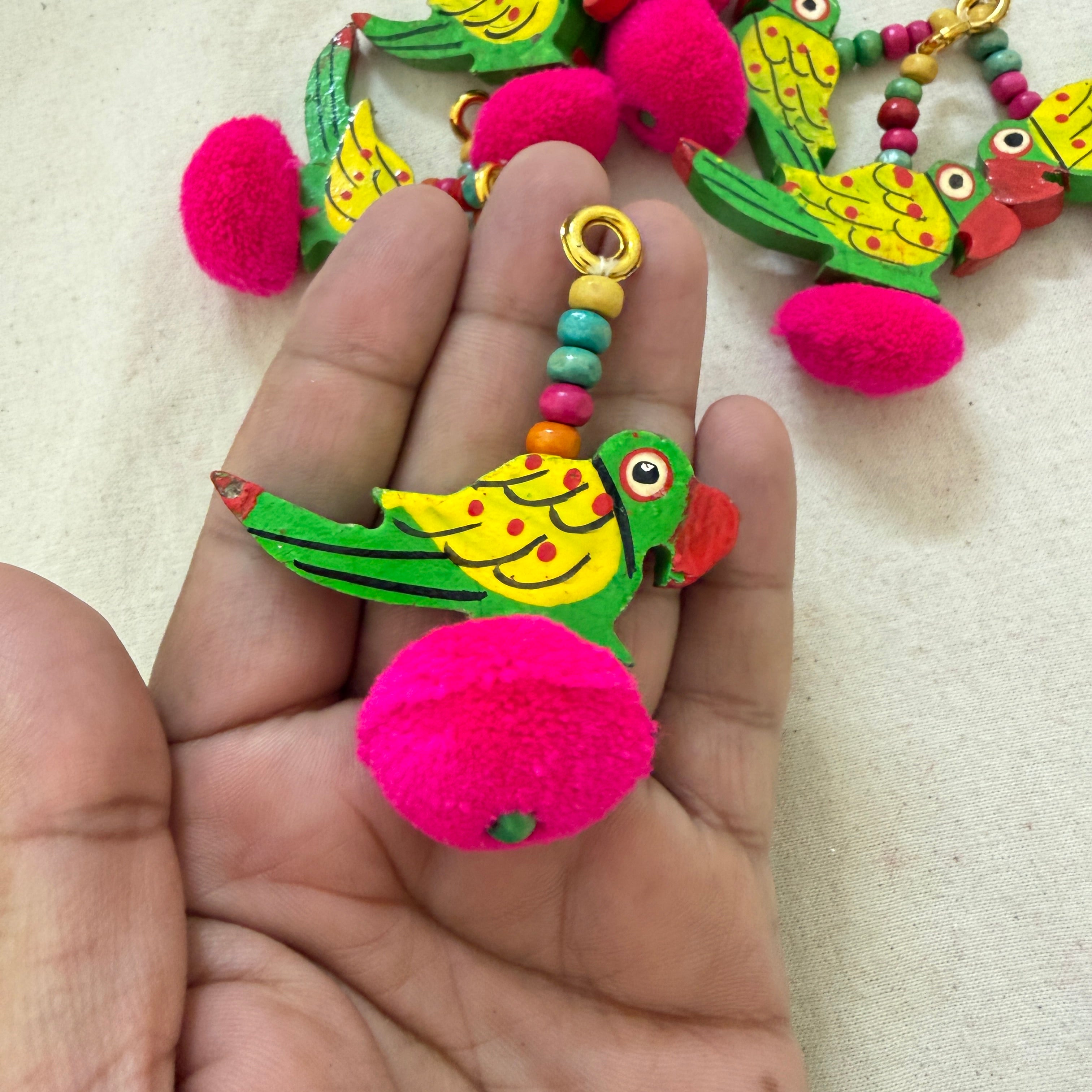 Parrot Pom Pom Tassel held in hand showing size and detail