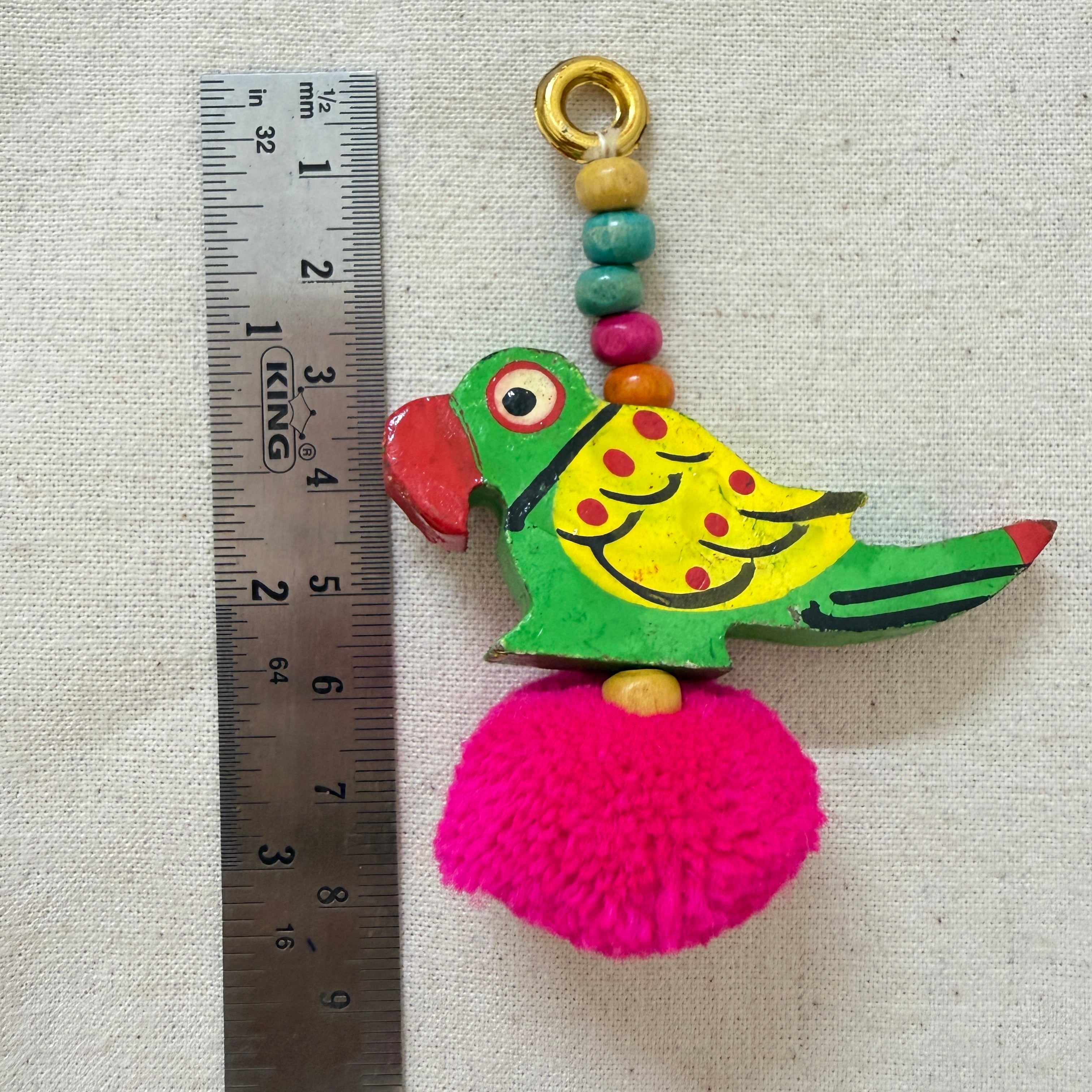 Parrot Pom Pom Tassel with ruler showing approx 8cm length