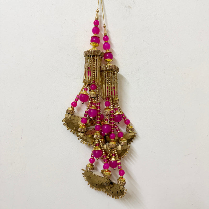 Pair of Magenta Beaded Kiran Latkans hanging showing full length and detail